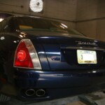 Before and after photographs of a damaged, blue, Maserati that was repaired by Elite Paint & Body Shop in West Palm Beach, FL.